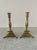 A gorgeous pair of Neoclassical style brass candle holders with paw feet Circa Mid-20th Century Measures: 5.25"W x 5.25"D...