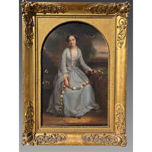 Pierre dupuis (1833-1915) portrait of a young girl with flowers oil on canvas preserved in an antique carved and gilded...
