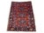 A beautiful antique Heriz rug, handwoven circa 1910 with a geometrical 3 medallion design on a rich terracotta field and...
