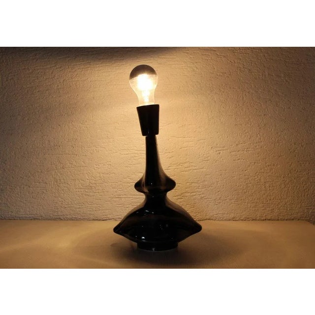 Stunning modernist style ceramic table lamp. It will quickly find its place on a side table or a sideboard and will bring...