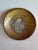 Highly unusual art pottery dish or plate with a tic on it. It is signed and dated. I can't make out the signature or the...