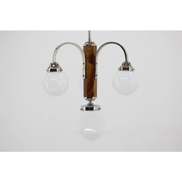 Completely restored Art Deco chandelier. Walnut with new shellac finish. Chrome with minor patina polished. Rewired: two...