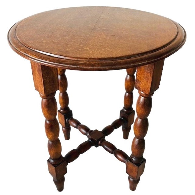 Mid-century bobbin legs side table, wine table, or plant table from the 1960s. The table is made of solid oak and is in...