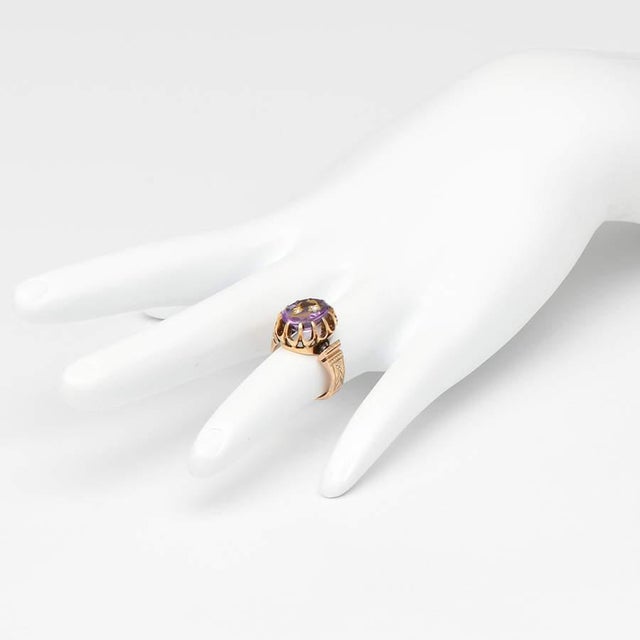 With lovely lavender hues working in concert, this stunning synthetic amethyst ring will catch the eyes of your admirers....