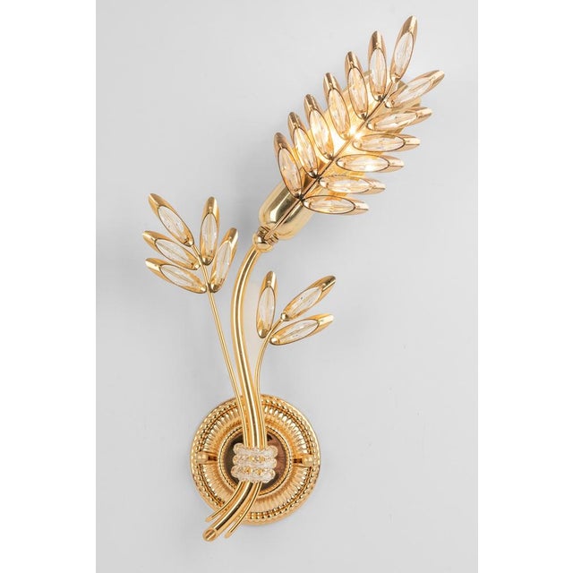 Pair of mid-century gilt brass wall sconce with crystal glasses, made by palwa, germany, manufactured circa 1970-1979....