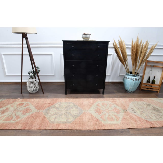 Vintage Hand-Knotted runner rug is a semi-antique vintage runner rug. The '70s Eastern region of Anatolian's unique rug is...