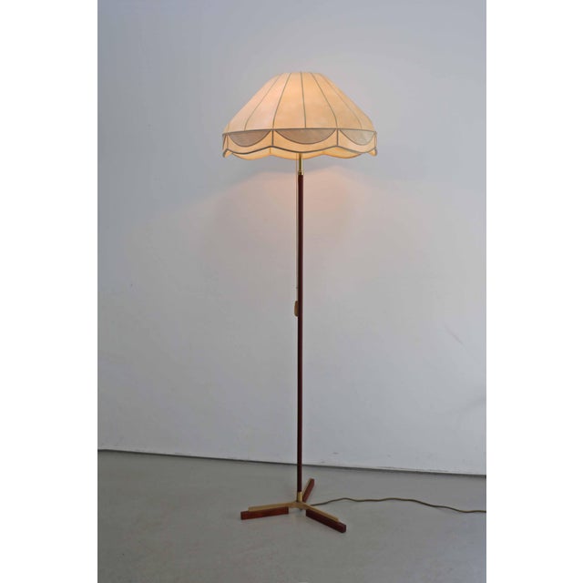 Scandinavian Modern Design Danish Tripod Teak/Brass Floor Lamp Cocoon-shaped lampshade Made in Denmark, 1960s Height 154cm...