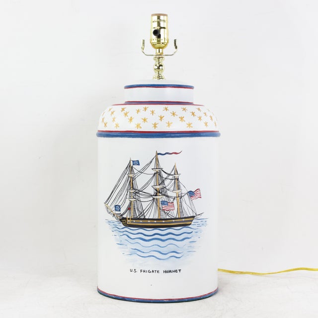 This rare pair of vintage tole table lamps features a classic metal construction with a smooth, hand-painted finish...