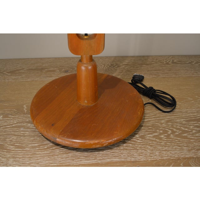 Danish modern floor lamp with sculpted wood design. New black fabric cord and brass dimmer socket. 12"W x 57"H