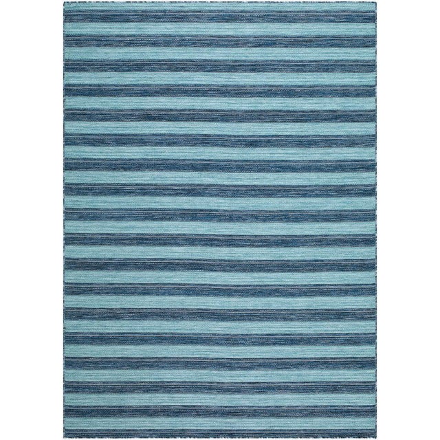 Transform your outdoor space into a coastal haven with the Patio Plus area rug, where traditional style meets modern...