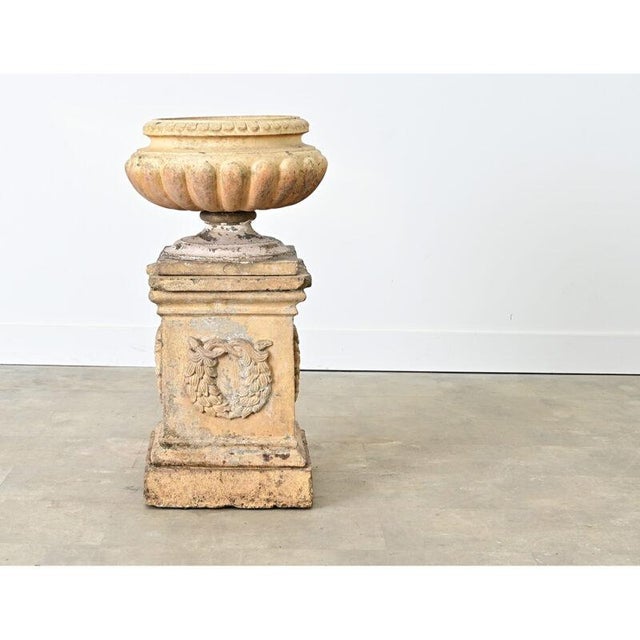 English late 19th century Neoclassical garden urn of the “campania” or “campagna” style mounted on a substantial square...
