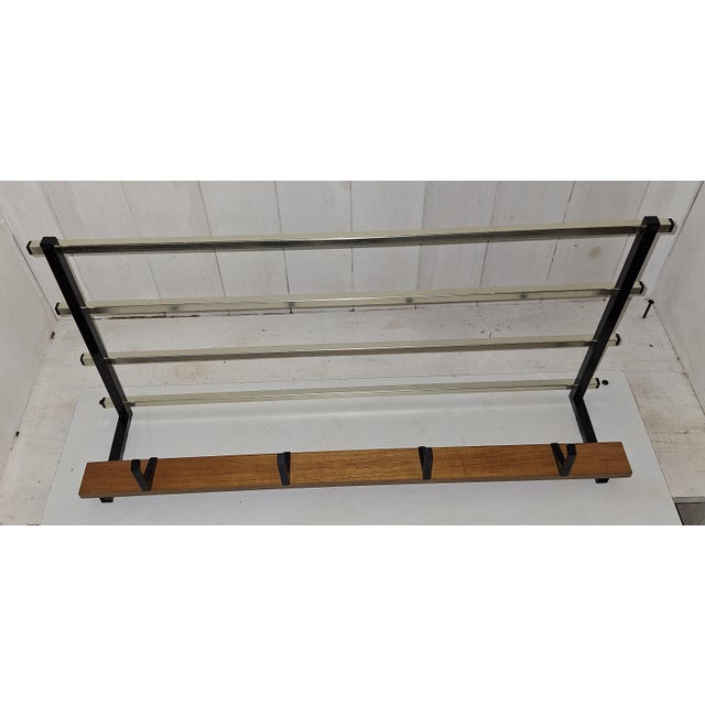 Vintage Wall-Mounted Coat Rack with Black Iron Frame, Brass-Coloured Hat Shelf and Teak Wood Strip, 1970s, in Very Good...