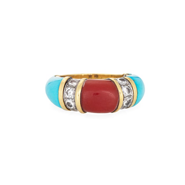 Stylish turquoise, coral & diamond band (circa 1970s) crafted in 18k yellow gold. Turquoise is inlaid into the band...