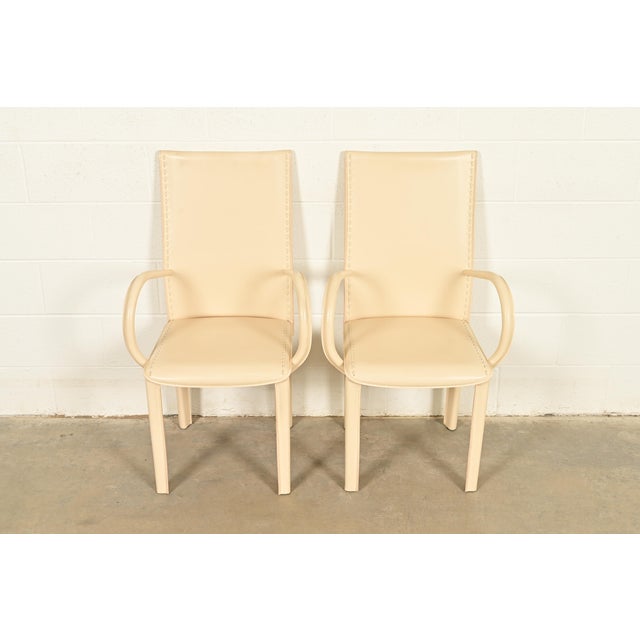 A sleek and stylish pair of Italian Modern or Postmodern high back armchairs or dining captain chairs In the manner of...