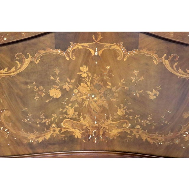 This French inlaid carved walnut bed attributed to the esteemed R.J. Horner is a masterclass in antique furniture design,...