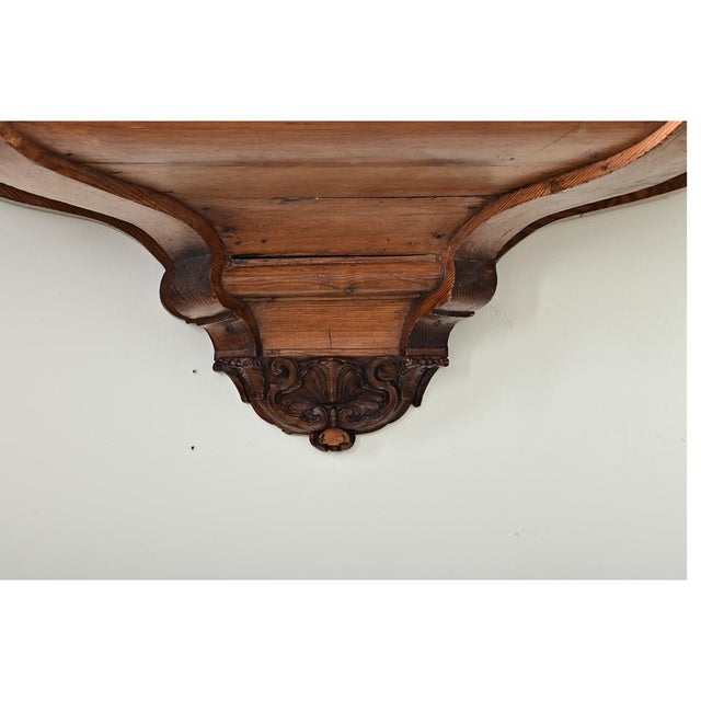 A magnificent pair of 18th century Portuguese carved pine wall consoles, also called brackets, originally part of the...