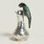 Vintage pitcher handcrafted in silver plate on hammered copper in modern form featuring a stone clad parrot as a handle....