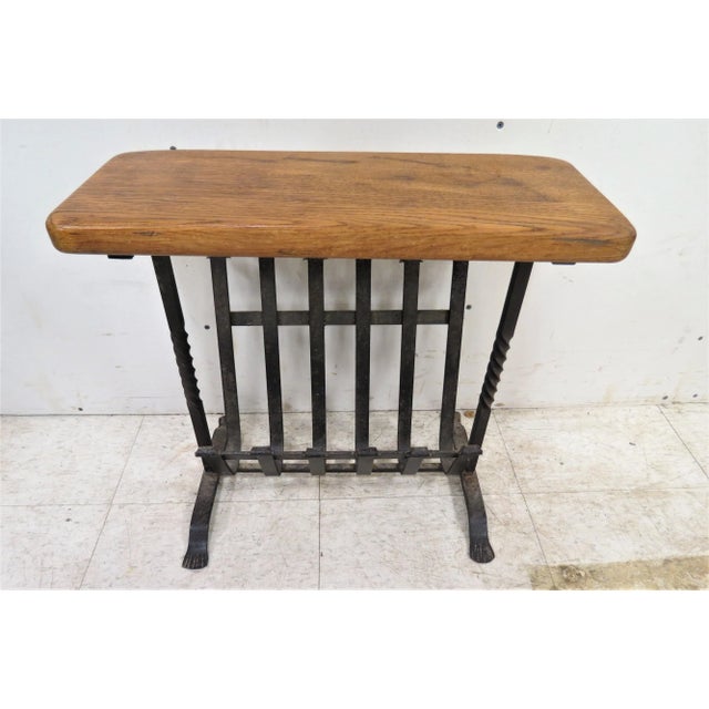 This great little magazine rack was imported from England. It features a sturdy iron back with a solid oak top. It's great...