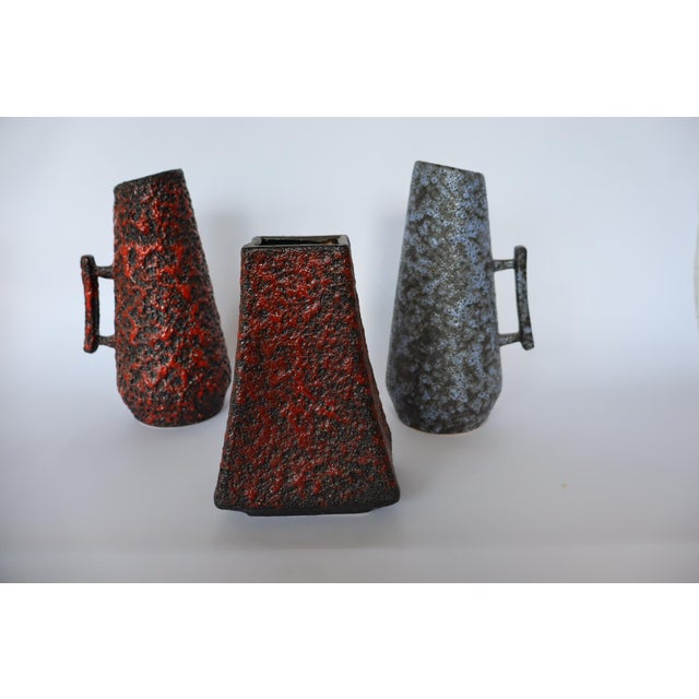 A nice set of 3 Fohr ceramic vases or jugs in Lava technique. Typical 1960's West-German pottery in clay. Fine condition...