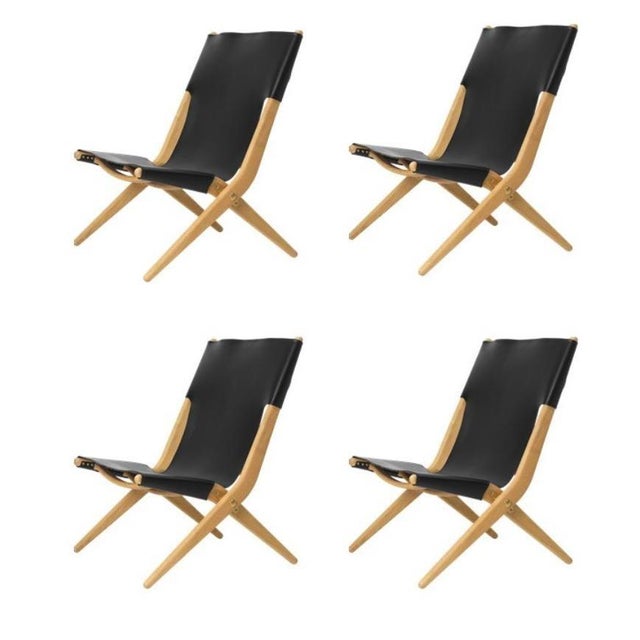Set of 4 natural oiled oak and black leather saxe chairs by Lassen Dimensions: W 60 x D 67 x H 84 cm Materials: leather,...