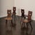 A sculptural set of four Brutalist dining chairs in the style of Belgian maker Torck. Crafted in solid wood with carved...