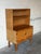This versatile oak cabinet combines open upper display shelving with enclosed lower cabinet storage. Raised on distinctive...