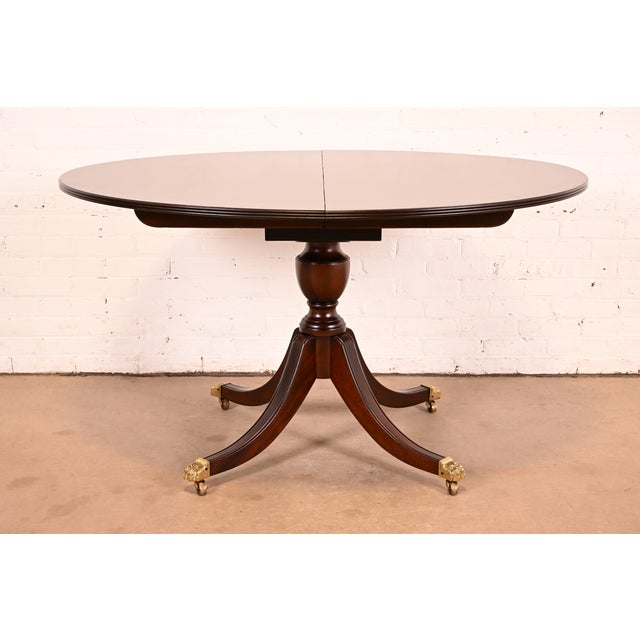 An exceptional Georgian or Regency style pedestal extension dining table By Stickley USA, 1998 Beautiful solid mahogany...