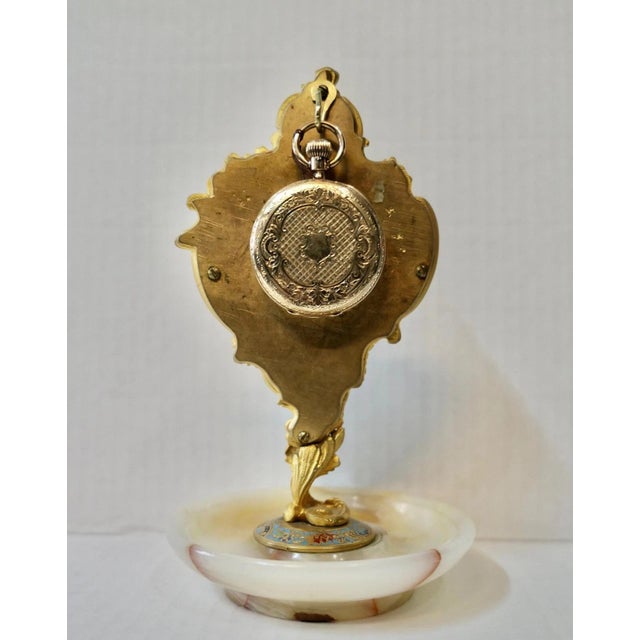 This rare antique 19th century Continental desk top pocket watch holder is wonderfully preserved. The dore’ bronze & onyx...