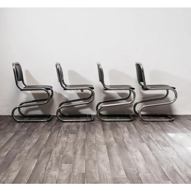 Set of 4 Chromed Steel Cantilever Chairs, 1980s Vintage Modern Design. The frame is entirely made of chromed tubular...