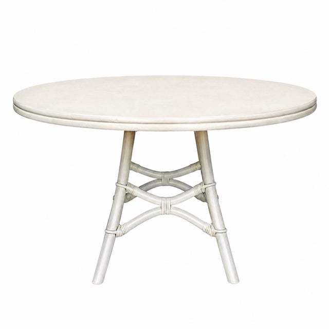 A charming vintage game table and chair set by Ficks Reed, embodying the relaxed elegance that made the maker a favorite...