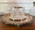 English Edwardian biscuit barrel featuring a deeply cut crystal body with classic diamond-pattern detailing, housed within...