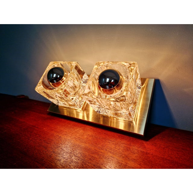 Double wall sconces in brass and ice cube glass, produced by the german manufacturer peill & putzler, 1970s....