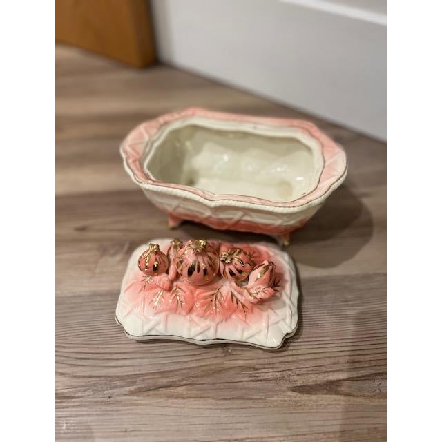 This item is a vintage mid-century ceramic or porcelain lidded trinket box, likely made in Japan, featuring a pink and...