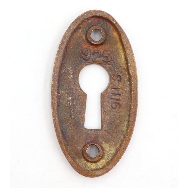 Vintage Classic style oval shaped keyhole cover plate made of brass with an antique brass finish. The original mounting...