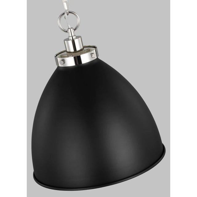 Inspired by various classic utility silhouettes - from factory lighting to barn sconces - capped by contrasting metal...
