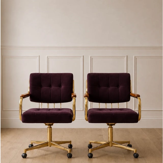 Upholstered in a rich deep burgundy velvet, the chairs exude warmth and elegance while showcasing a soft plush texture...