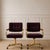 Upholstered in a rich deep burgundy velvet, the chairs exude warmth and elegance while showcasing a soft plush texture...