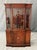 This vintage mahogany bookcase/china cabinet features a stately design with a glass-paneled upper section showcasing...