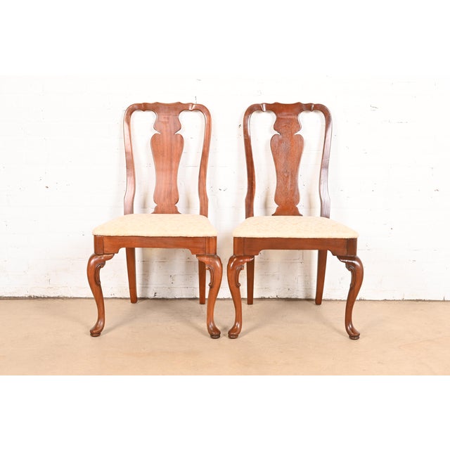 A gorgeous pair of Queen Anne or Georgian style dining chairs In the manner of Henkel Harris USA, Circa 1970s Solid...