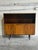 This elegant mid-sized Bookcase features an upper open display shelf sitting above a lower two-door storage cabinet. It is...