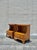 Warm and quietly sculptural, this pair of vintage pecan wood nightstands balances clean lines with softened architectural...