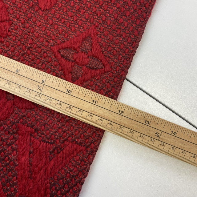 Louis Vuitton Red Thick Wool & Silk Scarf. Logomania-style monogram knit in red with tonal LV motifs and fringed ends. 94%...