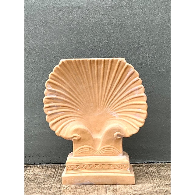 This vintage eco-plaster clam shell console pedestal has a sculptural shell form and a softly textured plaster finish. Its...