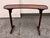 Design Plus Gallery presents an Antique Kidney-Shaped Reading/Altar Table in the style of Elsie de Wolfe. The mahogany-...