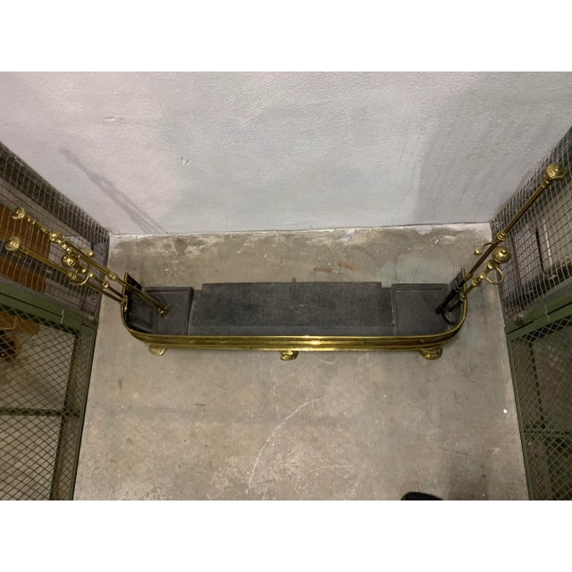 Vintage art nouveau brass fireplace set. The fender is a brass cut out in the art nouveau style. The set also includes the...