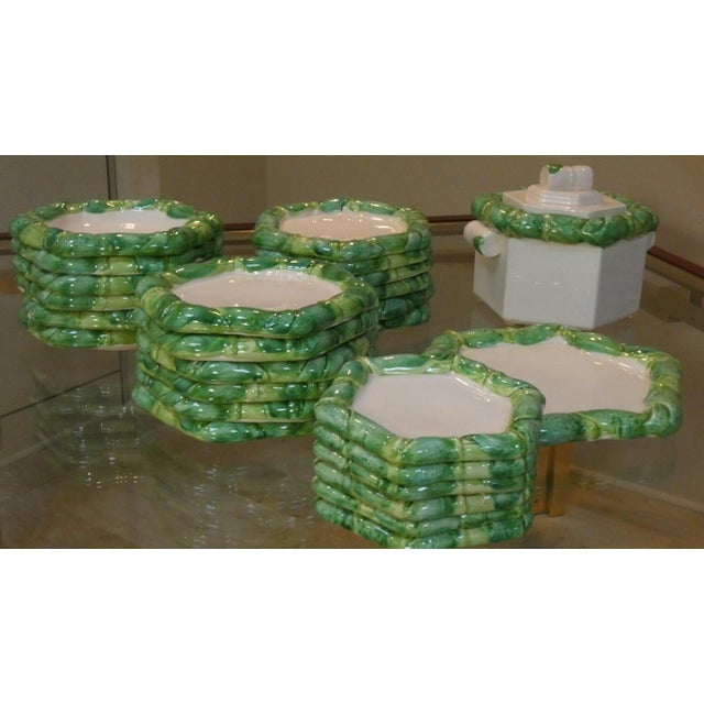 A beautiful hand-painted, glazed earthenware dinnerware set, designed by colin morrow and produced by arpex international...