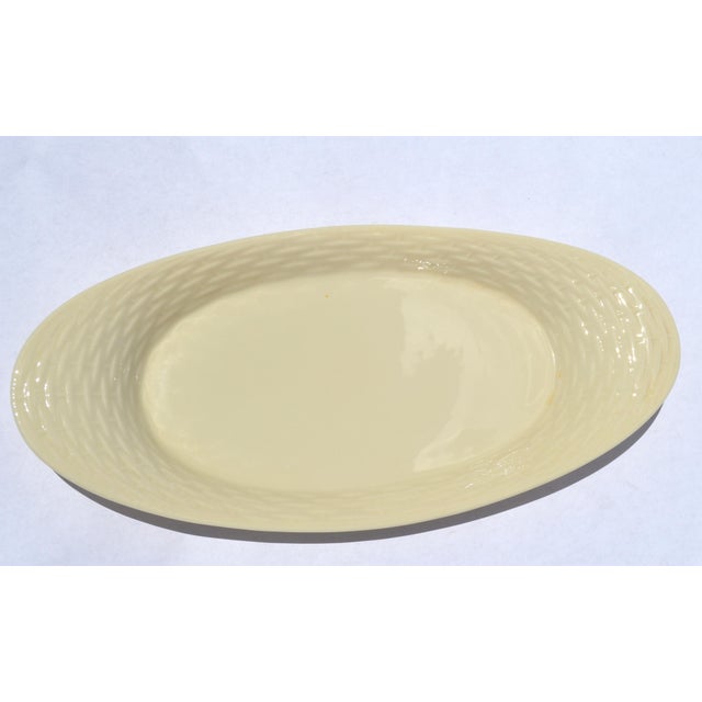 This Lenox Special Oval Platter in Basket Weave Pattern is a distinguished piece of Mid-Century Modern American fine...