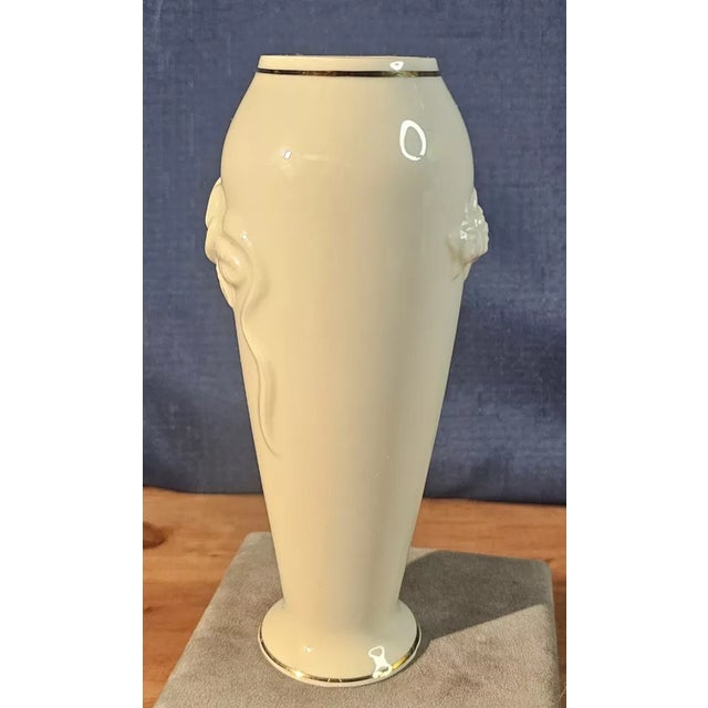 Add a touch of timeless elegance to your décor with this Lenox Rosebud Collection vase. Crafted in fine ivory porcelain,...