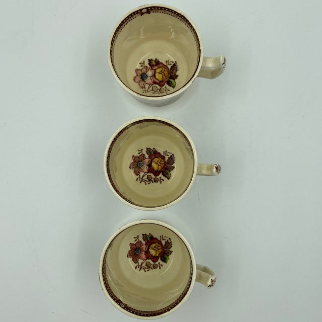 A delightful rare find, set of three vintage English demitasse cups in the celebrated Tonquin pattern by Clarice Cliff for...