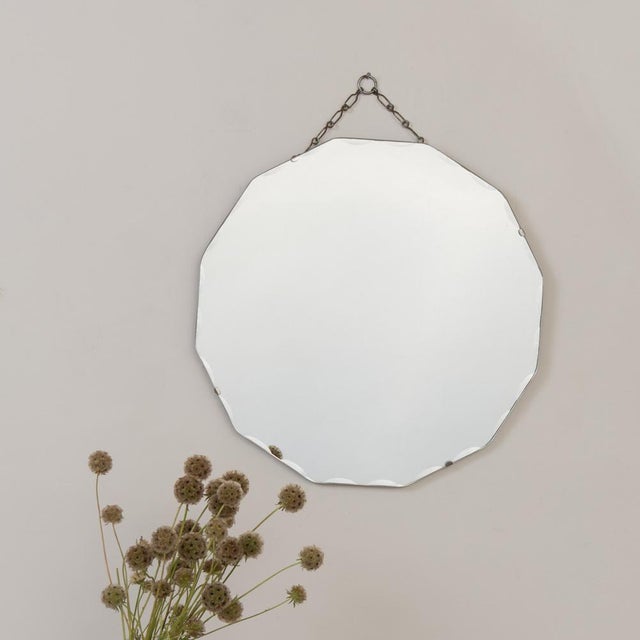 Incredible Art Deco mirror from France, 1930s. Dodecagon mirror with beveled edge secured to a wooden back. Mirror hangs...